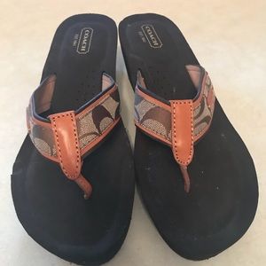 Coach “juliet” logo wedge flip-flop sandals.